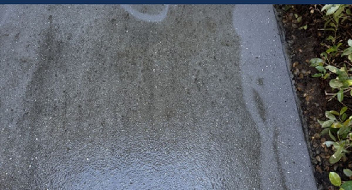 Concrete patio before pressure washing